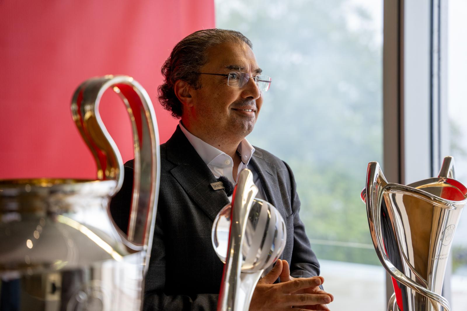 Ahmed Essam, CEO of European Markets at Vodafone, with the (l-r) UEFA Champions League trophy, UEFA Women’s EURO trophy and UEFA Women’s Champions League trophy.